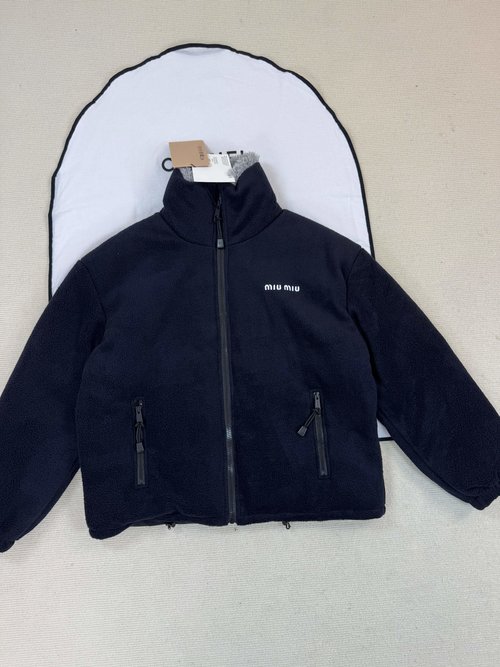 Miu Miu Distinguished Coat Enhanced with Subtle Detail Features