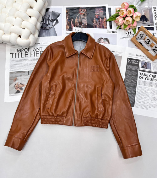 Miu Miu Leather Jacket and Skirt Set with Brand Emblems for a Stylish Appearance
