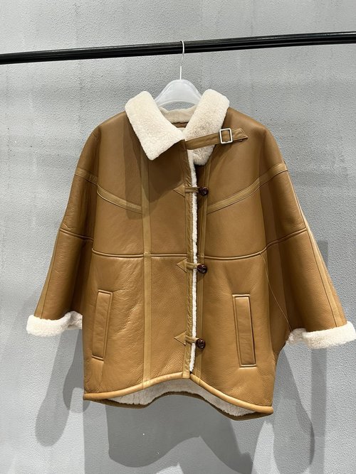Yves Saint Laurent Oversized Shearling Cape: Thick and Warm Design