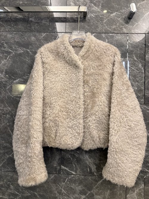 The Row Exclusive Lightweight Lamb Fur Coat with V - neck and Classic H - shape