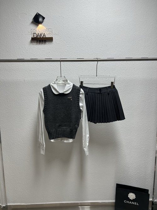 Miu Miu Knit Vest Layered Over White Shirt with Pleated Skirt Trio