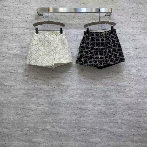 Dior Elegant Black and White Tweed Kilt with Metal D Buckle